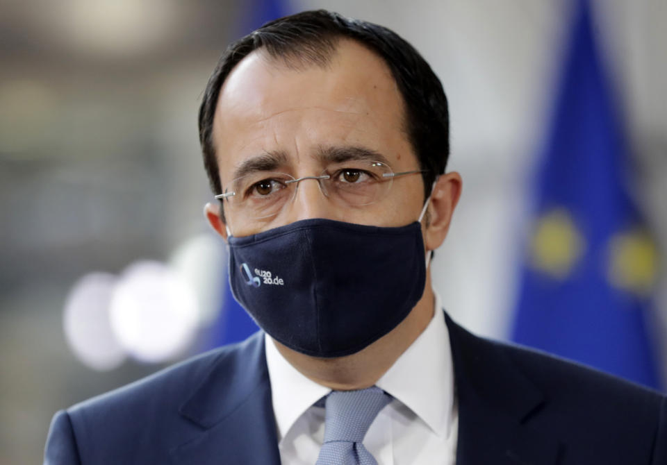 Cypriot Foreign Minister Nicos Christodoulides prepares to make a statement prior to a meeting of EU foreign affairs ministers at the European Council building in Brussels, Monday, Sept. 21, 2020. European Union foreign ministers on Monday were weighing whether to impose sanctions on dozens of Belarus officials, including President Alexander Lukashenko, after holding talks with the country's exiled opposition leader. (Olivier Hoslet, Pool via AP)