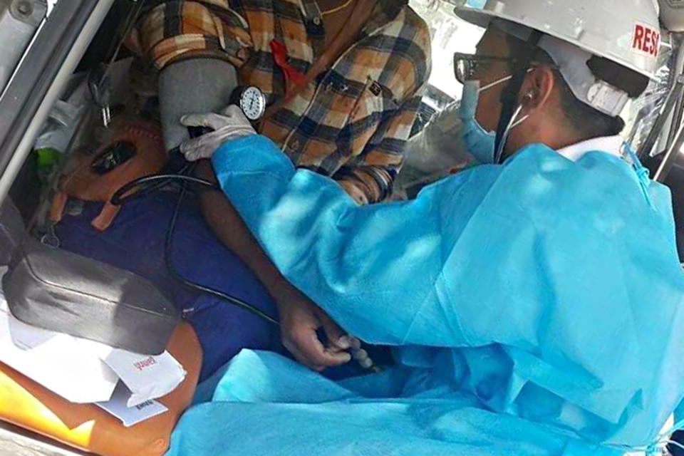 In this March 5, 2021 photo obtained by The Associated Press, Dr. Nay Lin Tun tends to a patient wounded in a protest in Yangon, Myanmar. “In other country’s protests, the medics are safe. They are exempt. Here, there are no exemptions,” says the general practitioner who has been on the run since February, and now provides care covertly. (AP Photo)