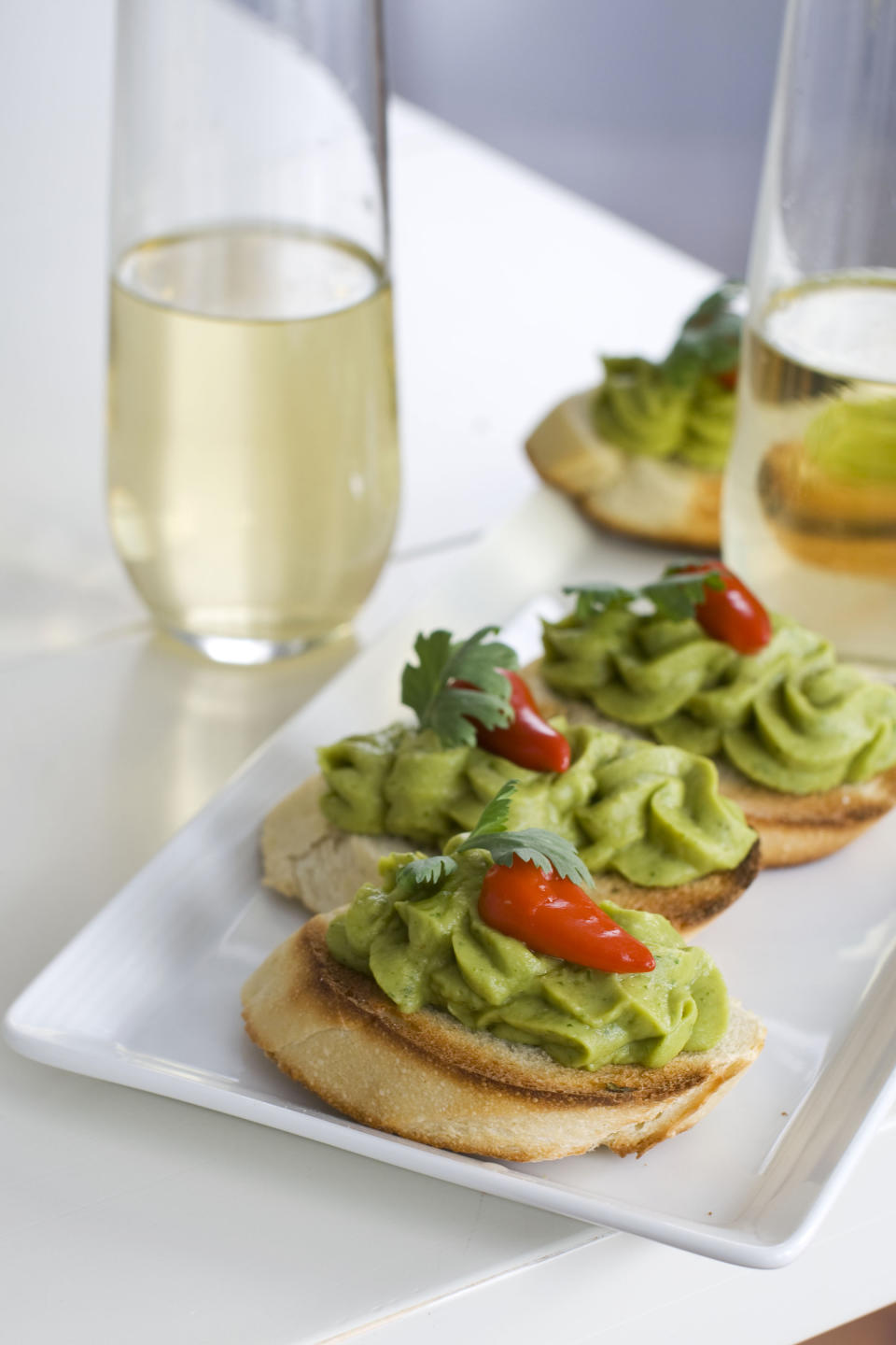 In this image taken on Monday, November 26, 2012, Christmas sangria and spring pea guacamole are shown in Concord, N.H. (AP Photo/Matthew Mead)