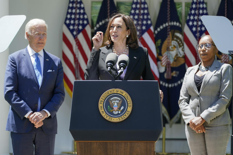 President Joe Biden listens as Vice President Kamala Harris speaks at an event on lowering the cost of high-speed internet in the Rose Garden of the White House, Monday, May 9, 2022, in Washington. (AP Photo/Manuel Balce Ceneta)