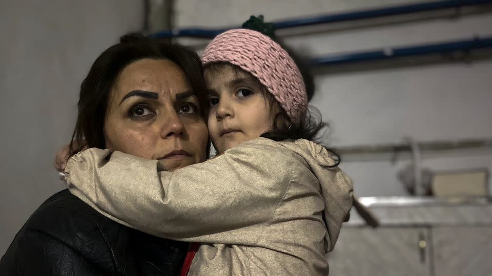 A girl embraces her relative sitting in a shelter during shelling in Stepanakert, Nagorno-Karabakh.  - Siranush Sargsyan/AP