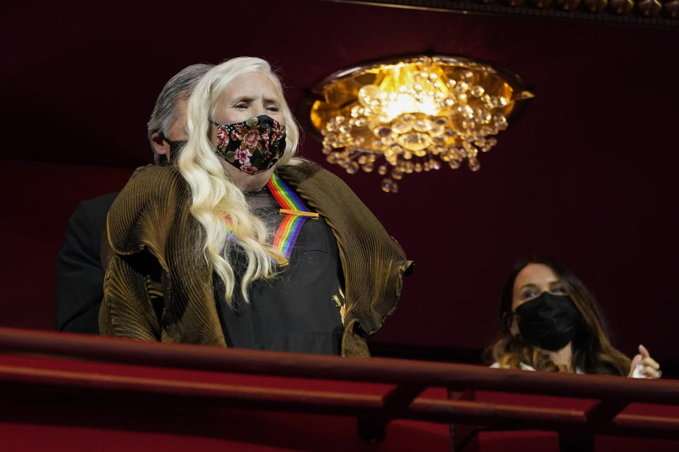 Folk music legend Joni Mitchell arrives at the 44th Kennedy Center Honors at the John F. Kennedy Center for the Performing Arts in Washington, Sunday, Dec. 5, 2021. The 2021 Kennedy Center honorees include Mitchell, Motown Records creator Berry Gordy, "Saturday Night Live" mastermind Lorne Michaels, actress-singer Bette Midler, and opera singer Justino Diaz. (AP Photo/Carolyn Kaster)