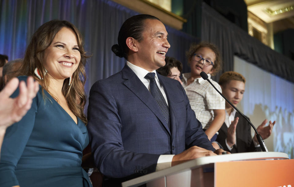 Manitoba NDP leader Wab Kinew delivers his victory speech, alongside his wife Lisa Monkman, winning the Manitoba Provincial election in Winnipeg, Manitoba, Tuesday, Oct. 3, 2023. The Canadian province of Manitoba has elected the first First Nations premier of a province in Canada. (David Lipnowski/The Canadian Press via AP)