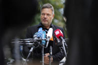 Co-party leader of the Greens Robert Habeck arrives for party leadership meeting in Berlin, Germany, Monday, Sept. 27, 2021. Following Sunday's election leaders of the German parties were meeting Monday to digest a result that saw Merkel's Union bloc slump to its worst-ever result in a national election and appeared to put the keys to power in the hands of two opposition parties. Both Social Democrat Olaf Scholz and Armin Laschet, the candidate of Merkel's party, laid a claim to leading the next government. (AP Photo/Matthias Schrader)