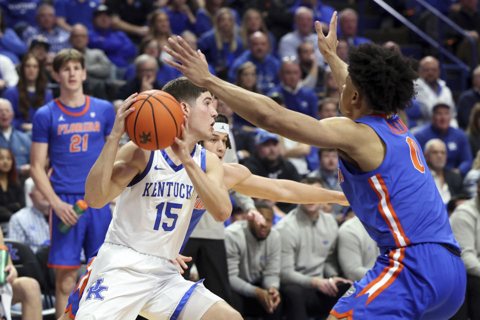 Kentucky's Reed Sheppard (15) looks for an opening on Florida's Zyon Pullin (0) during the first half of an NCAA college basketball game Wednesday, Jan. 31, 2024, in Lexington, Ky. (AP Photo/James Crisp)