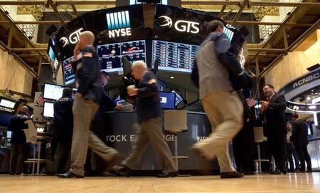 Traders work on the floor of the New York Stock Exchange (NYSE) in New York City, U.S., October 14, 2016. REUTERS/Brendan McDermid