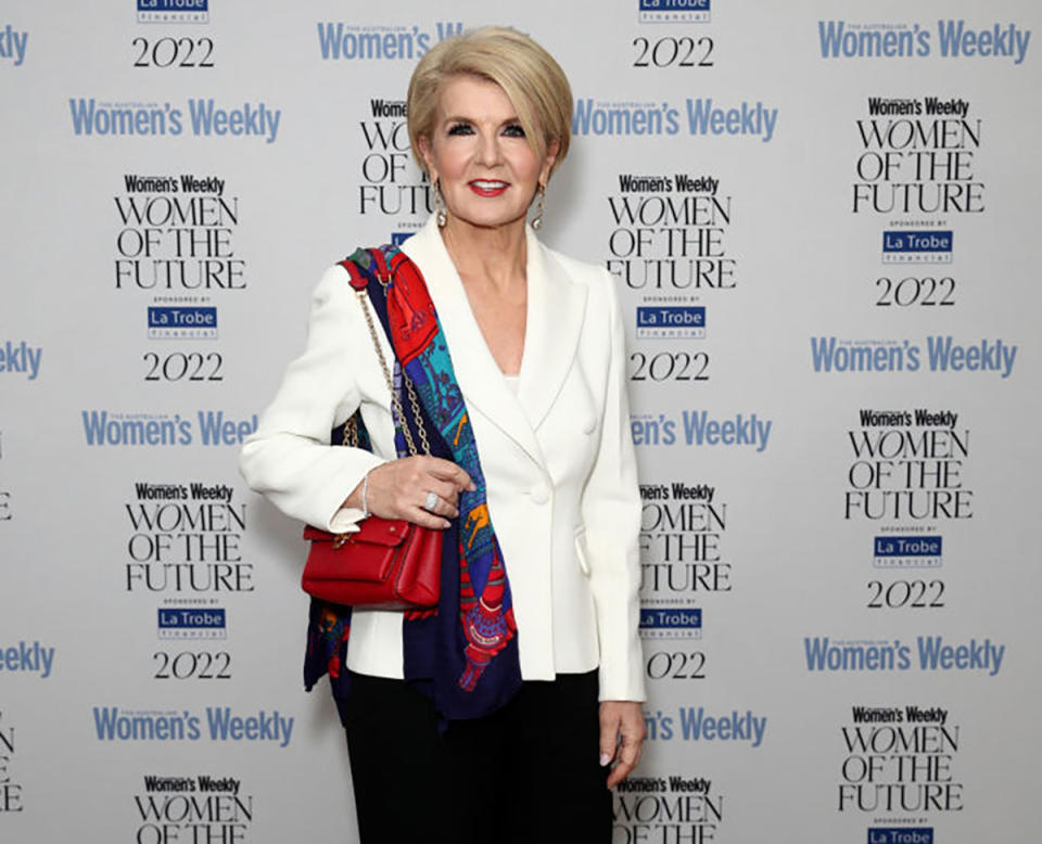 Julie Bishop in a white blazer in front of the Women of the Future Women's Weekly backdrop