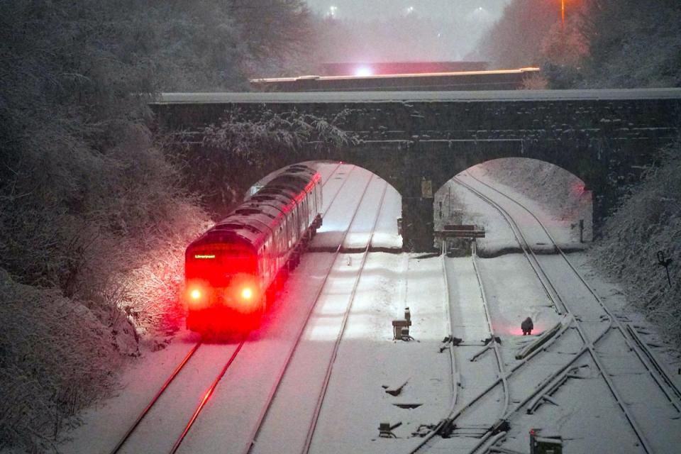 Snow has caused transport disruption with drivers urged to show caution (PA)