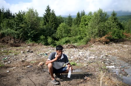 Migrant washes his teeth in camp Vucjak in Bihac