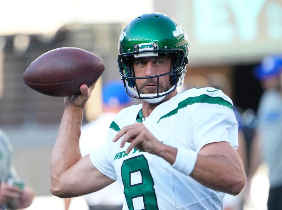 New York Jets quarterback Aaron Rodgers (8) warms up before a game against the New York Giants at MetLife Stadium.