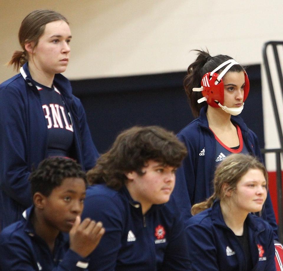 BNL's Alessia Agostini (right, back) locks into focus for her match while standing with Patrell Childs, Junior Arellano and Alivia Crane (front, l. to r.), and Katie Sites (back, left).