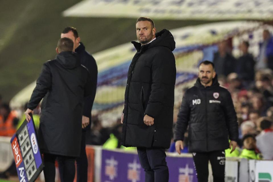 Ian Evatt looks up to the scoreboard late in Bolton's game at Barnsley in March <i>(Image: PA)</i>