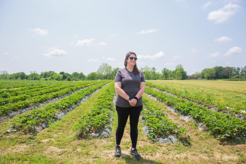 Megan Fields, farm manager of Eckert's Orchard poses for a selfie at a field of Eckert's Orchard in Versailles, KY on May 11, 2022.
