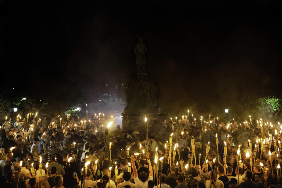 Neo-Nazis and white supremacists surround counterprotesters in Charlottesville, Virginia, in August&nbsp;2017. Trump has repeatedly refused to condemn racism, and white nationalists have been emboldened since his election. (Photo: NurPhoto via Getty Images)