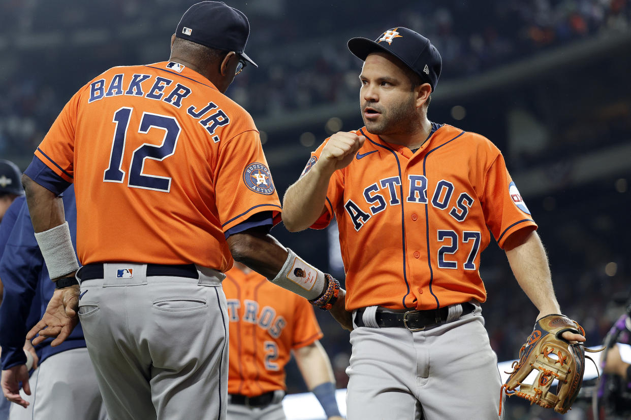 José Altuve celebrates the Game 3 win with manager Dusty Baker. (Carmen Mandato/Getty Images)