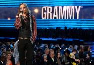 <p>Johnny Depp, at the Grammys? Yes, the actor showed up to introduce Mumford and Sons - he is apparently a big fan and has been spotted hanging out with Marcus Mumford.</p>