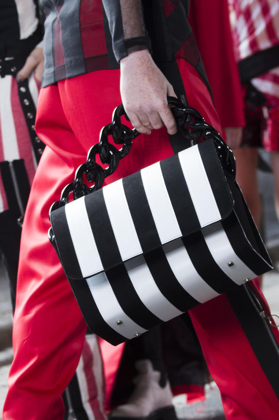 <p><i>Black-and-white-striped chain bag from the SS18 Marques’Almeida collection. (Photo: ImaxTree) </i></p>