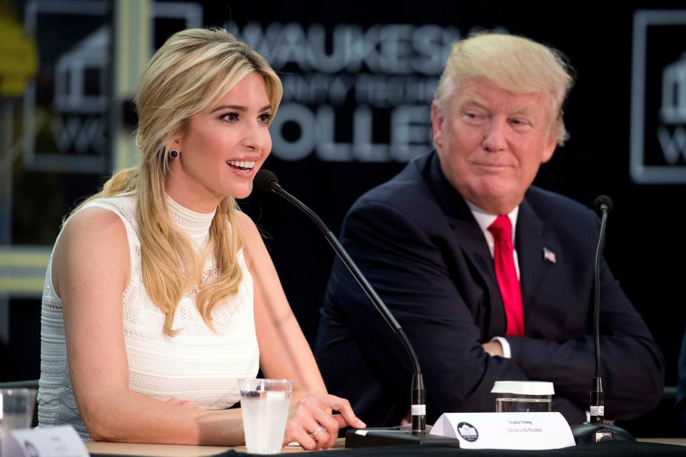 President Donald Trump listens as his daughter, Ivanka Trump, speaks at a workforce development roundtable at Waukesha County Technical College on June 13, 2017. 