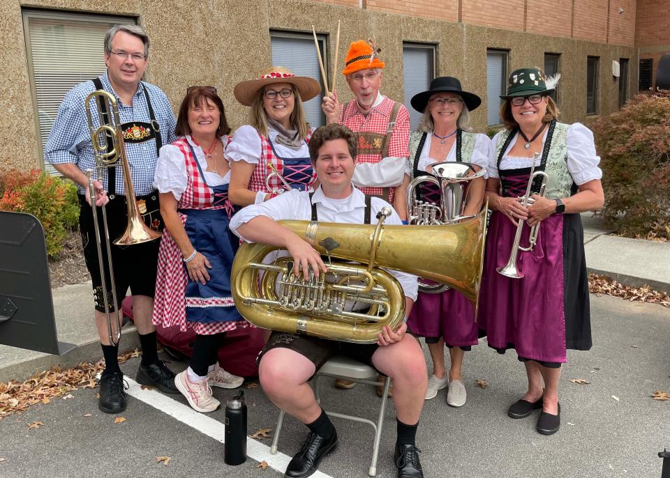 The Concord Brass Quintet entertains the crowd with polka music. In front is Ben Cooper; back are Allen Segraves, Wendy Schneider, Gayle Friedele, Paul Garrison, Susan Lewis and Sandra Burnett.