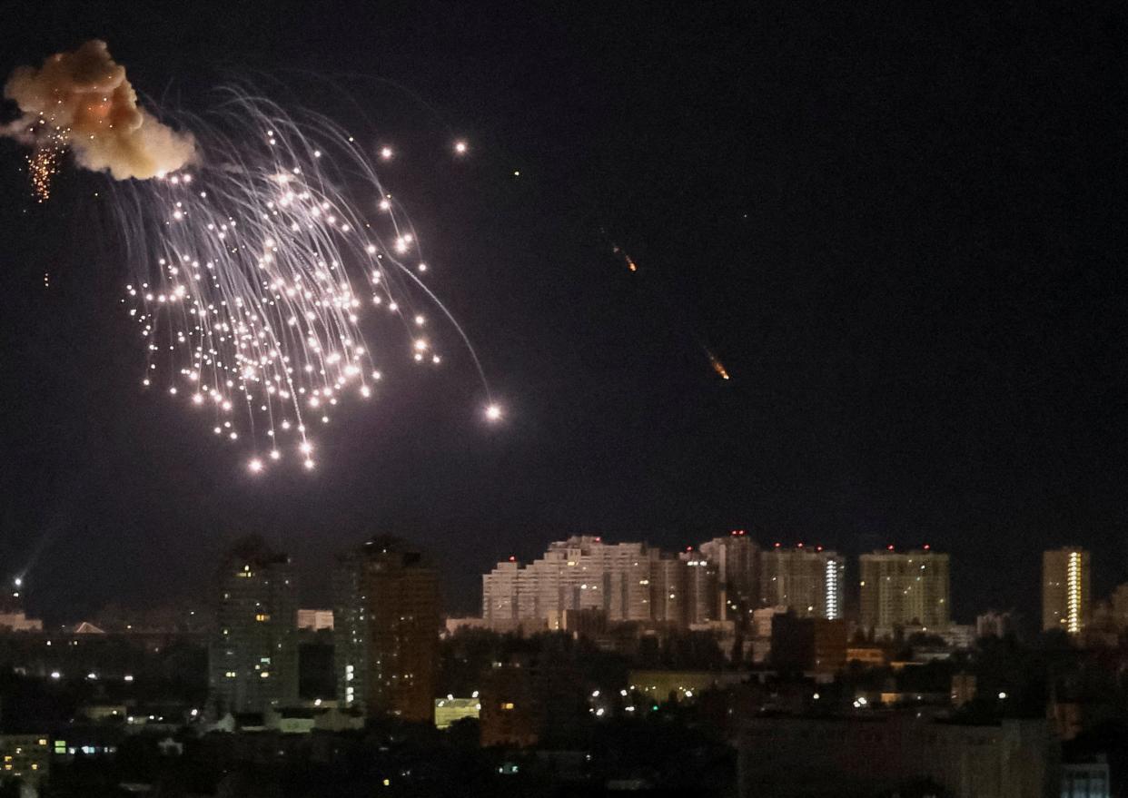 An explosion of a drone is seen in the sky over the city during a Russian drone strike early on Sunday (REUTERS)