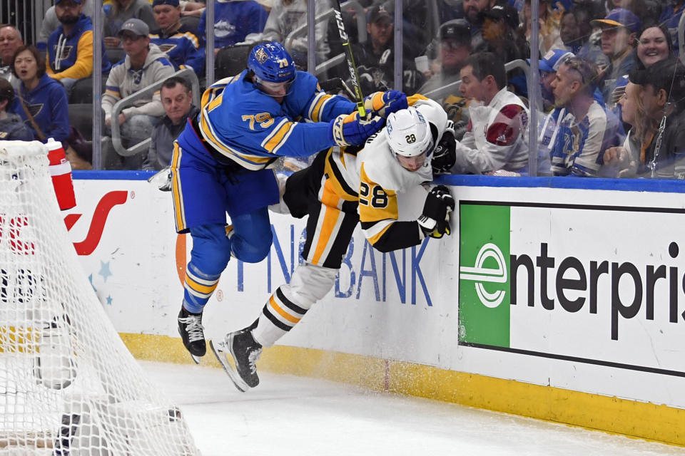 St. Louis Blues left wing Sammy Blais (79) checks Pittsburgh Penguins defenseman Marcus Pettersson (28) during the second period of an NHL hockey game, Saturday, Feb. 25, 2023, in St. Louis. (AP Photo/Jeff Le)