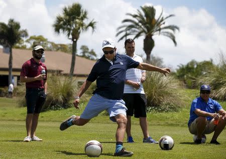 A FootGolfer kicks the ball down the fairway at Largo Golf Course in Largo, Florida April 11, 2015. REUTERS/Scott Audette