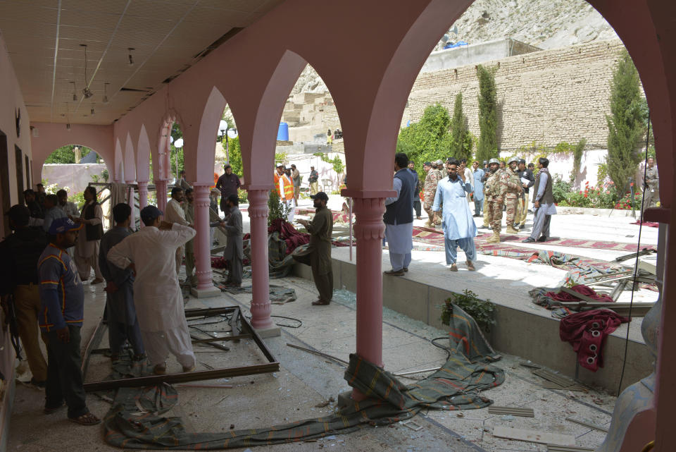 Pakistani officials examine a mosque following a bomb blast in Quetta, Pakistan, Friday, May 24, 2019. (AP Photo/Arshad Butt)