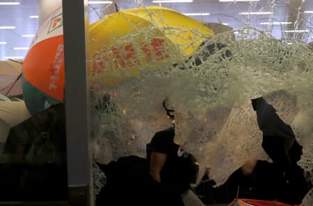 Protesters break into the Legislative Council building during the anniversary of Hong Kong's handover to China in Hong Kong
