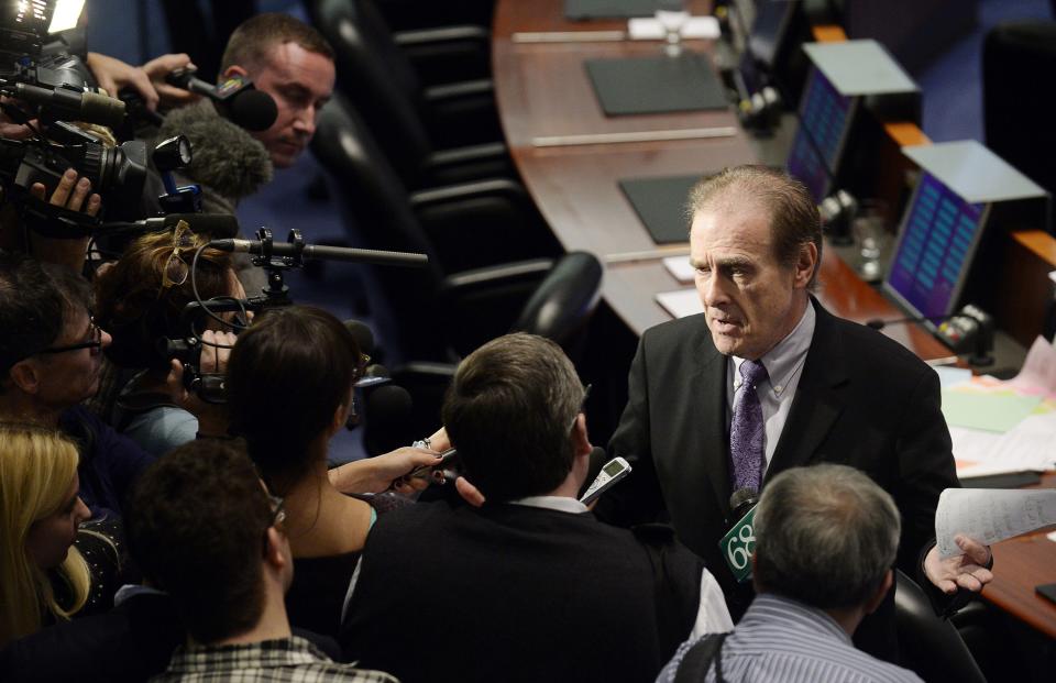 Toronto Deputy Mayor Norm Kelly speaks to the media after a special council meeting at City Hall in Toronto