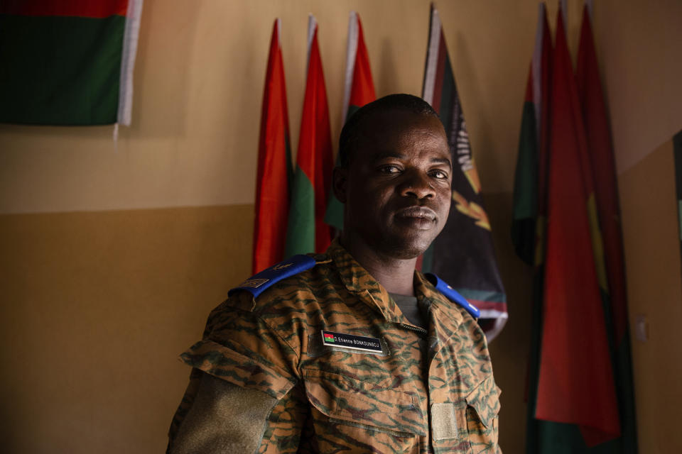 Etienne Bonkoungou, a pastor and military chaplain, stands for a portrait at the 10th RCAS army barracks in Kaya, Burkina Faso, Saturday, April 10, 2021. Bonkoungou says he regularly counsels troops grappling with the question of whether their participation in the fight makes them defenders or killers. “The Bible says not to kill, so as a soldier these questions often arise. ... To kill another, to watch a colleague die (or kill someone yourself), should you kill? Should you not kill?” (AP Photo/Sophie Garcia)