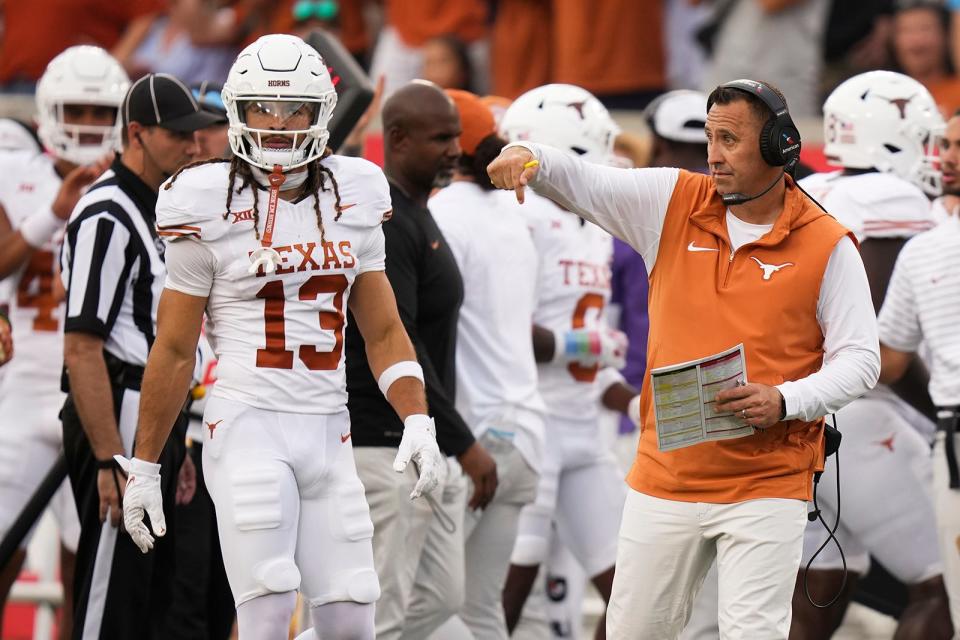 Texas head coach Steve Sarkisian motions to players during Saturday's 31-24 win over Houston. He now has to navigate his team through starting quarterback Quinn Ewers' shoulder injury. Backup quarterback Maalik Murphy and freshman Arch Manning will lead the way until Ewers returns.