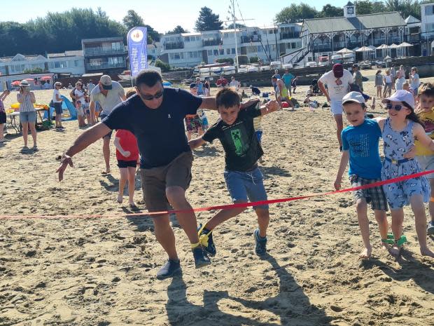 Isle of Wight County Press: Three legged race at Bembridge Harbour Family Fun Weekend.