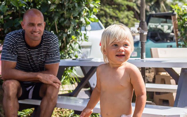 Kelly Slater with 22-month-old Van, who he saved from a freak wave at a beach in Hawaii. Photo: @chris.whitey