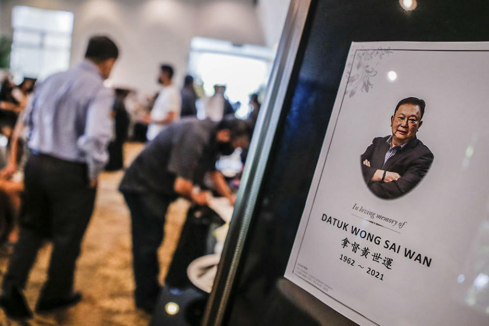 People pay their last respects to Datuk Wong Sai Wan during his wake service at the Xiao En centre in Kuala Lumpur May 15, 2021. — Picture by Hari Anggara