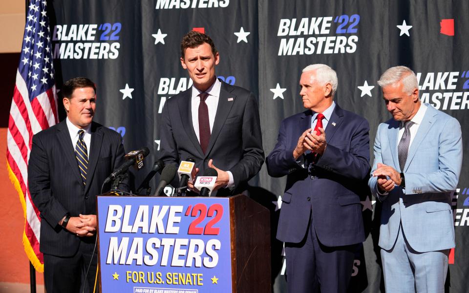 Blake Masters holds a press conference with Arizona Gov. Doug Ducey and former Vice President Mike Pence at a school choice event on Oct. 11, 2022.