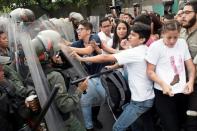 Street protests erupted for a second day in Caracas as students marched on the Supreme Court, where they scuffled with soldiers