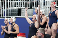 FILE - The team from the United States celebrates after winning against Hungary during the women's water polo final at the World Aquatics Championships in Doha, Qatar, Friday, Feb. 16, 2024. (AP Photo/Lee Jin-man, File)