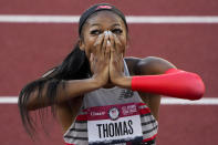 Gabby Thomas celebrates after winning the final in the women's 200-meter run at the U.S. Olympic Track and Field Trials Saturday, June 26, 2021, in Eugene, Ore. (AP Photo/Chris Carlson)