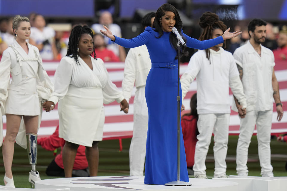 Country music artist Mickey Guyton performs the national anthem before the NFL Super Bowl 56 football game between the Los Angeles Rams and the Cincinnati Bengals, Sunday, Feb. 13, 2022, in Inglewood, Calif. (AP Photo/Chris O'Meara)