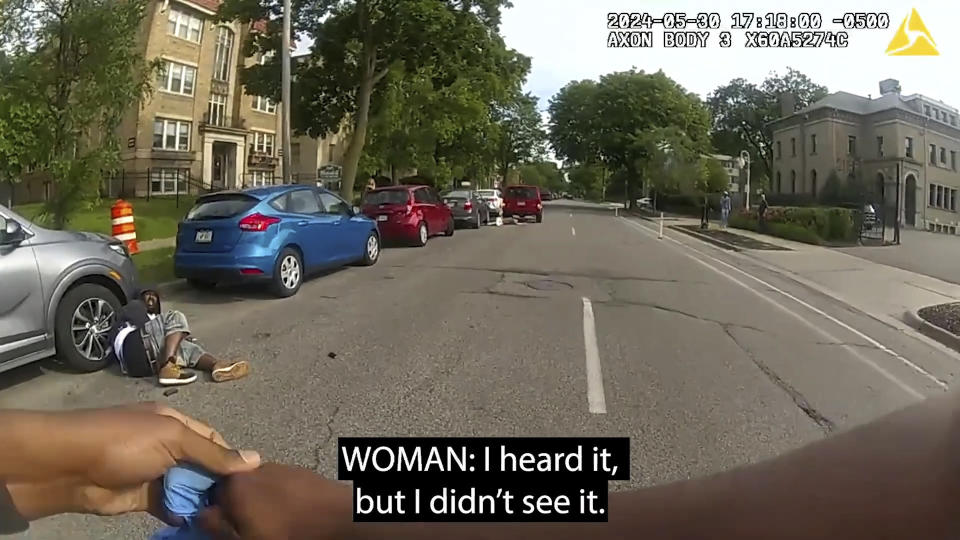 This frame from body-camera video released show Minneapolis Police Officer Jamal Mitchell approaching Mustafa Mohamed to render aid moments Mohamed produced a handgun and fatally shot him on May 30, 2024 in Minneapolis, Minn. (Minneapolis Police Department via AP)