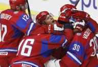 Russia's Andrei Mironov celebrates with teammates after they defeated Canada to win the bronze medal in their IIHF World Junior Championship ice hockey game in Malmo, Sweden, January 5, 2014. REUTERS/Alexander Demianchuk (SWEDEN - Tags: SPORT ICE HOCKEY)