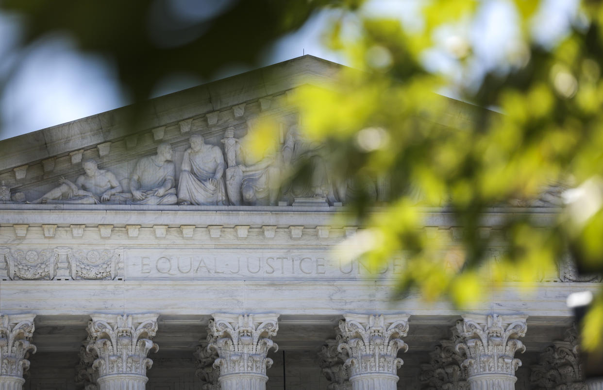 A view of the bas-relief of the portico of the U.S. Supreme Court.