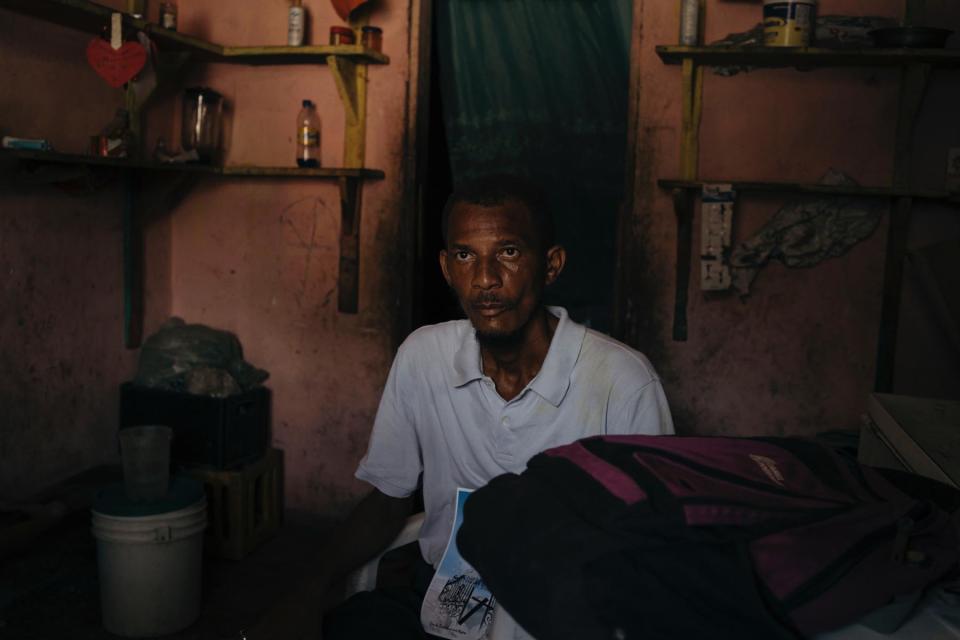 <br>Lourdy Denis in his former home, abandoned after his sons were killed heading to school