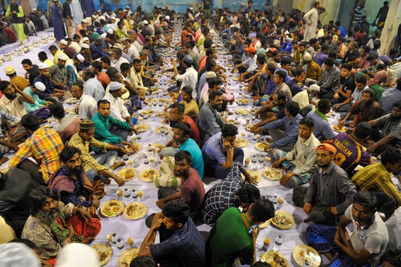 Fasting Muslims take part in Mass Iftar at Ribakibazar in Sylhet, during holy month of Ramadan. Md Rafayat Haque Khan/ZUMA Press Wire/dpa