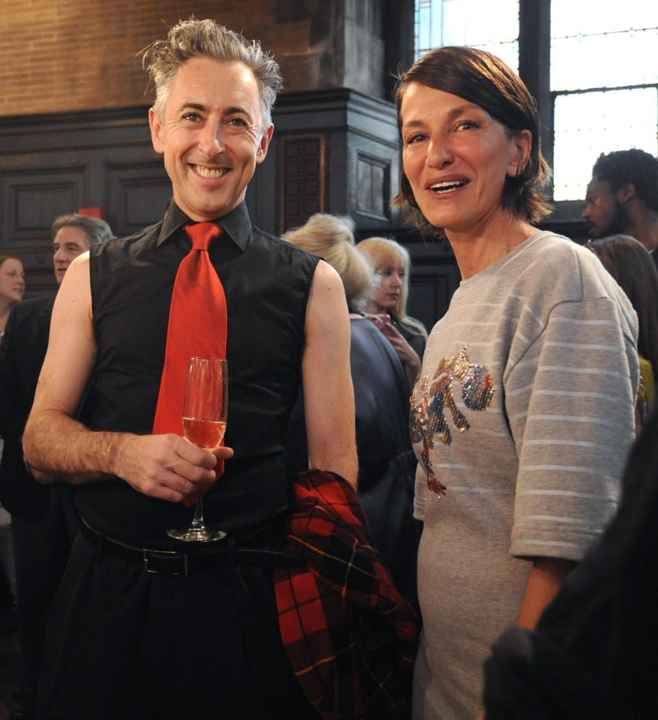 Designer Cynthia Rowley is photographed with actor Alan Cumming at the presentation of her Spring 2014 collection during Fashion Week, Saturday, Sept. 7, 2013, in New York. (AP Photo/Louis Lanzano)