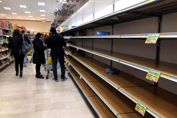 Empty shelves at a Milan supermarket as people stockpile due to the fear of the new coronavirus (EPA)