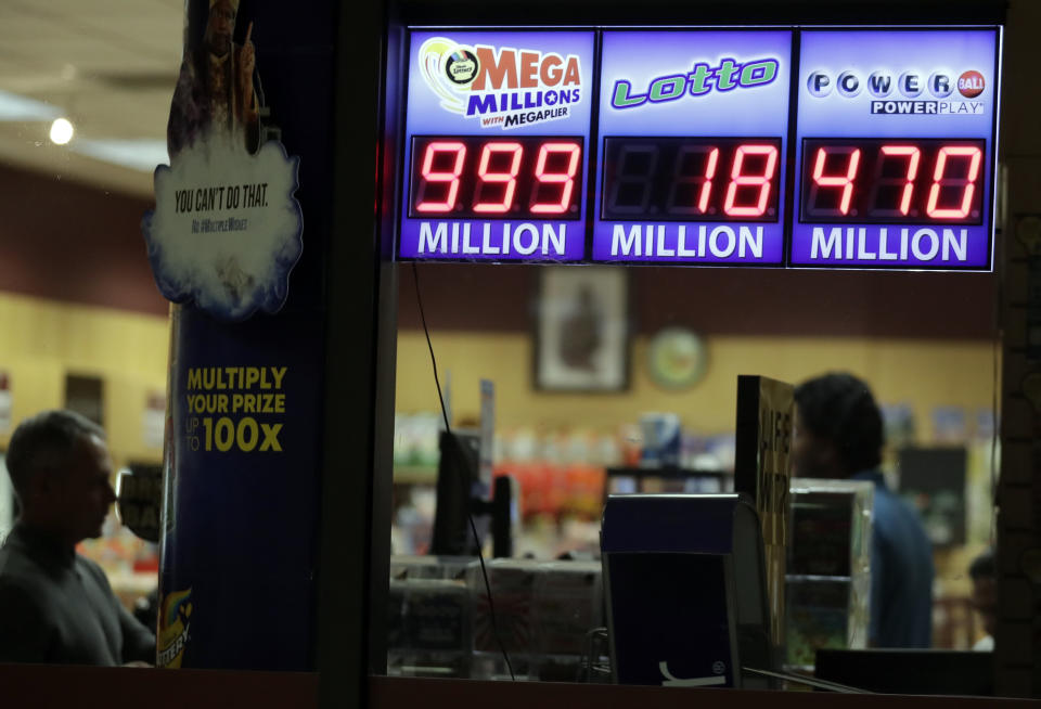 A sign displays the estimated Mega Millions jackpot at a convenience store in Chicago, Friday, Oct. 19, 2018. Friday's jackpot has soared to $1 billion, the second-largest prize in U. S. lottery history. (AP Photo/Nam Y. Huh)