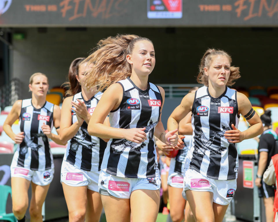 Collingwood players, pictured here entering for their AFLW clash with Brisbane Lions in March.