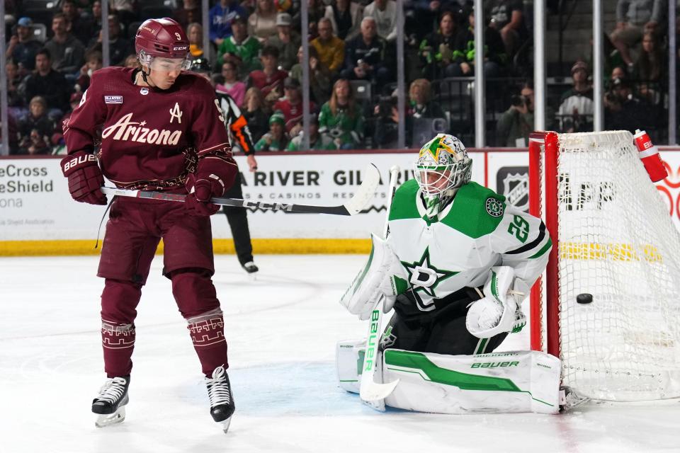 Arizona Coyotes right wing Clayton Keller (9) is unable to deflect the puck by Dallas Stars goaltender Jake Oettinger (29) during the second period at Mullett Arena.