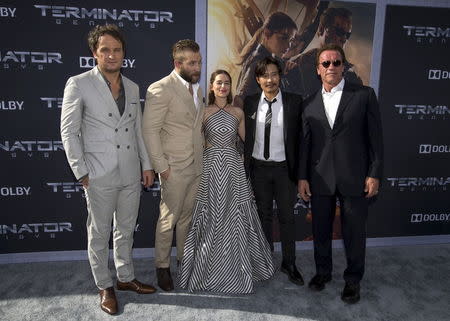 Cast members (from L-R) Jason Clarke, Jai Courtney, Emilia Clarke, Byung-hun Lee and Arnold Schwarzenegger pose. REUTERS/Mario Anzuoni